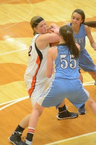 Nikki Grose protects the ball versus Perry Meridian. Grose led Warsaw to a 48-41 win with 22 points.