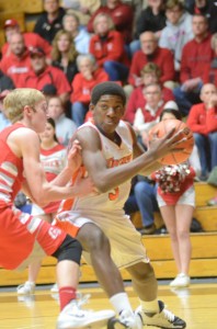 Paul Marandet makes a move on the baseline for Warsaw Tuesday night in sectional action versus Goshen.