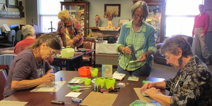 Pictured from left are Pam Pollard, Jan Biehl and Delores Kirkham as they create their own greeting cards during the library’s Make and Take Card Class, held at 10:30 a.m. the first Thursday each month (Photo provided)