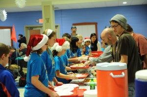 Students of Eisenhower Elementary School served the dinner hosted by Fellowship Missions Wednesday night. (Photo by Al Disbro)