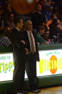 Bill Patrick, right, talks with  Whitko coach Scott Wessel prior to their game last Friday night in Akron.