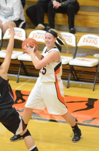 Senior Lindsay Baker looks to pass the ball Thursday night during the championship game of the TCU Lady Tiger Classic. Baker helped Warsaw win the title to remain undefeated.