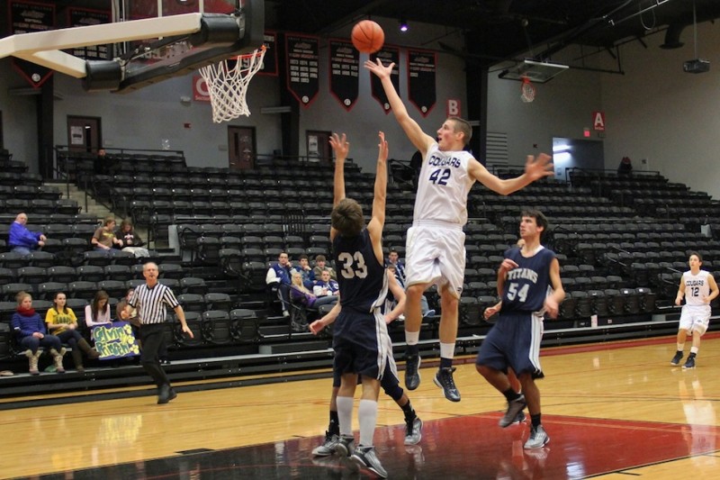 Calvin Prinsen of LCA goes in for a shot  versus South Bend Trinity in the Cougar Classic Friday at Grace College. Prinsen poured in 28 points in a 58-55 overtime win (Photo provided by Cindy Silveus) 