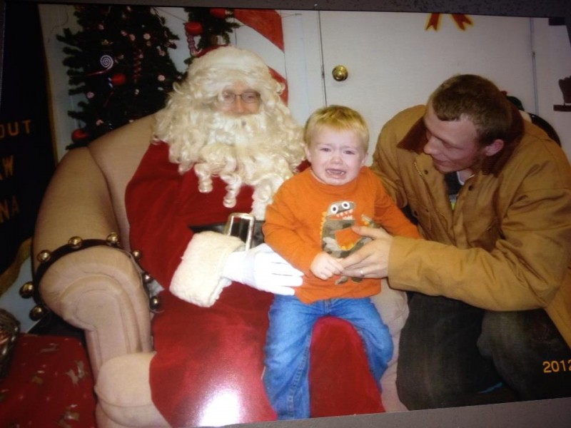 Izac Garza wasn't exactly happy to meet Santa, but we're sure we'll grow to appreciate the jolly old elf in time.
