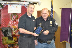 A.J. Westerman was given an Award of Valor in appreciation for his heroic efforts at the Milford Town Council meeting, because he put out a small fire at Lakeland Rehabilitation and Healthcare Dec. 1. The photo shows Town Marshal Rich Miotto, right, presenting Westerman with his award.