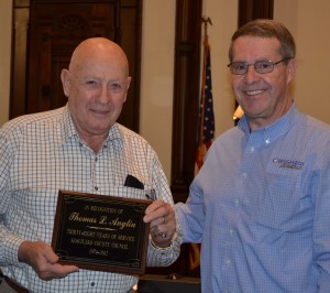 Long-time Kosciusko County Councilman John Anglin, left, was presented with a plaque for his years of service by Kosciusko County Comissioner Ron Truex. (Photo by Stacey Page)