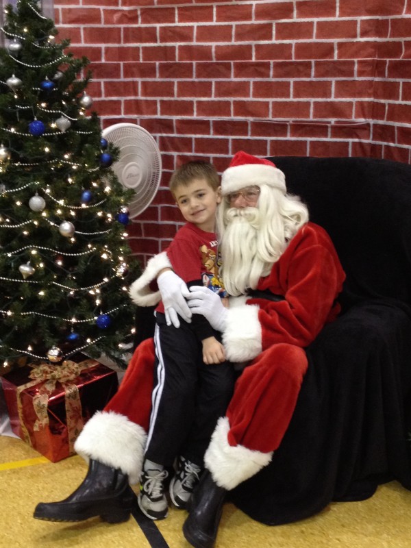Talen Ball, 6, met Santa at the Syracuse Community Center recently.