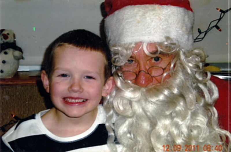 For such a young child, Travis Prater, 7, has had much sorrow in his life, including open heart surgery and absent close family members. "It is so special to see his delight in visiting with Santa," write Cindy Shelton, who submitted Travis' picture.