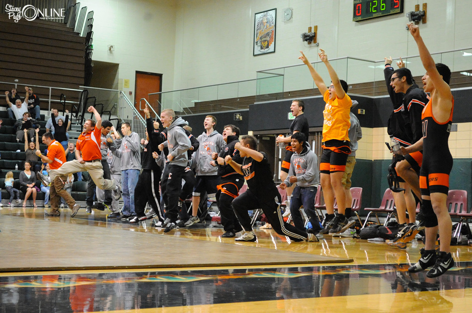 Warsaw's bench erupts in celebration after Luis Cervantes scored a pin to give the Tigers a 36-35 victory over Wawasee. (Photos by Mike Deak)