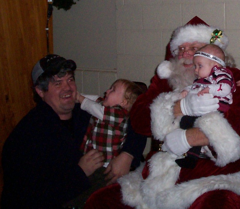 Carter Ewell and his sister met Santa recently, but Carter did not enjoy the experience. Parents are jason and Shelby Ewell.