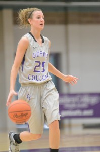 Goshen College senior Paige Davis, who played at Triton High School, brings the ball up the court Saturday.