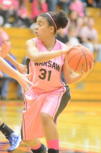 Warsaw's Brooklyn Harrison protects the basketball versus Carroll Wednesday night.