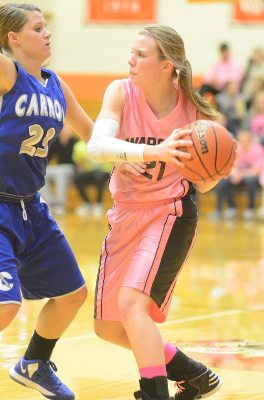 Senior guard Melanie Holladay looks for room against Carroll Wednesday night. Holladay played a strong all-around game as Warsaw won 62-43 to remain undefeated.