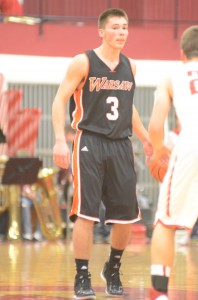 Warsaw's Jared Bloom surveys the defense Friday night at Goshen. Bloom scored 18 points in a 56-51 loss to the Redskins.