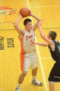 Warsaw's Jared Bloom looks for room Friday night. Bloom scored a game-high 22 points in a Tiger win over NorthWood.