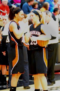 Jennifer Walker-Crawford, left, and Lindsay Baker of Warsaw chat during their game at NorthWood Saturday night. Warsaw drew Elkhart Memorial in the first round of the Concord Sectional.