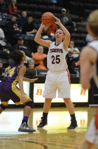 Warsaw's Lindsay Baker looks to pass Thursday night versus Marion. The Tiger standout tied a career high with 26 points in a 76-49 win.