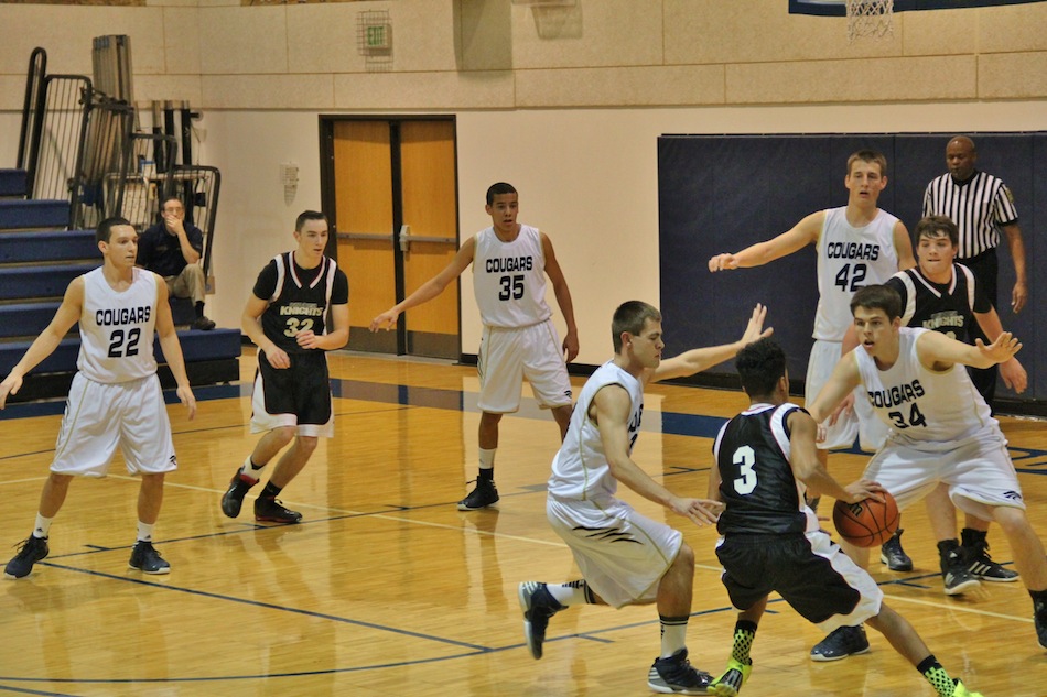 The LCA defense, led by Billy Pitts (No. 34), surround a Granger Christian player Tuesday night (Photo provided by Cindy Silveus)