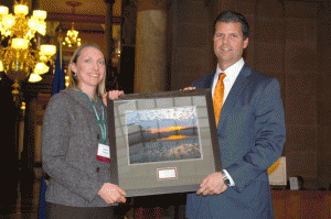 State Sen. Ryan Mishler (R-Bremen) was awarded the 2012 Conservation Legislator of the Year Award by Angela Hughes of the Indiana Conservation Alliance yesterday at Indiana’s Conservation Day at the Statehouse. Mishler was honored with the award for his involvement with the Sustainable Natural Resources Task Force and the Invasive Species Council. (Photo provided)