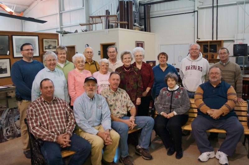 A gift from the Smiths’ estate established funds at the Kosciusko County Community Foundation that will benefit the Bell Aircraft Museum and the Bell Memorial Public Library, both located in Mentone. Seated from left are Scott Van Diepenbos and Tim Whetsone (museum), Jeff Bormet, Krystal Smith and Roger Moriarty (library). Standing from left are Sue Pyle, Lois Miller, and Mary Boggs (museum), Michelle Bormet, Linda Cochran (museum), Honey Kuhn, Jack Fisher, and Carl Jackson (library). In the back are Steve Rogers, Marsha Scott, Jerry White and Bill Martz (museum). (Photo provided)