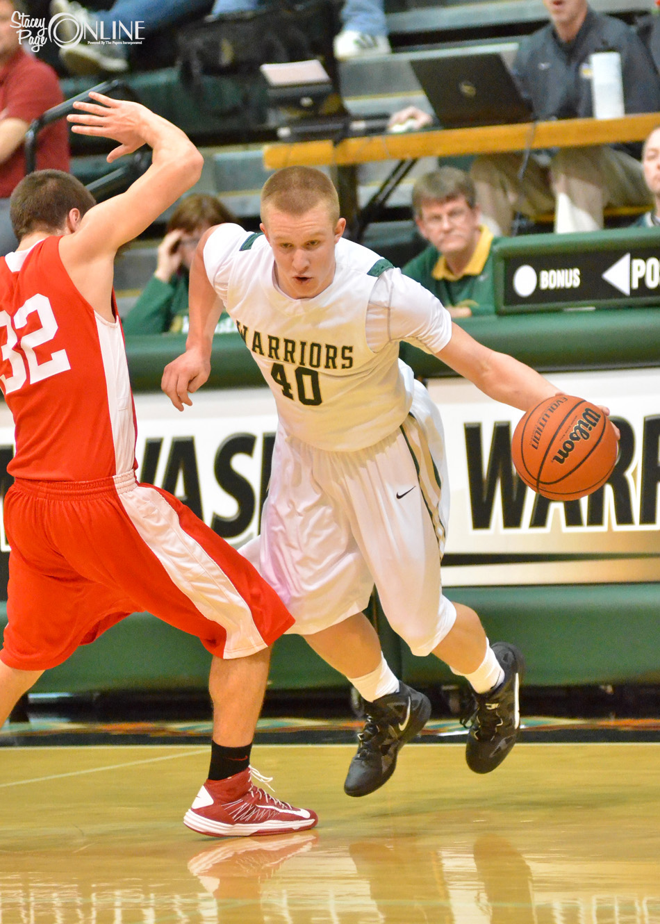 Wawasee's Alex Clark dribbles around Plymouth's Kyser McCrammer Friday night. The game was overshadowed by the news Wawasee student KC Ochs had committed suicide earlier in the day, sombering the atmosphere surrounding the contest.