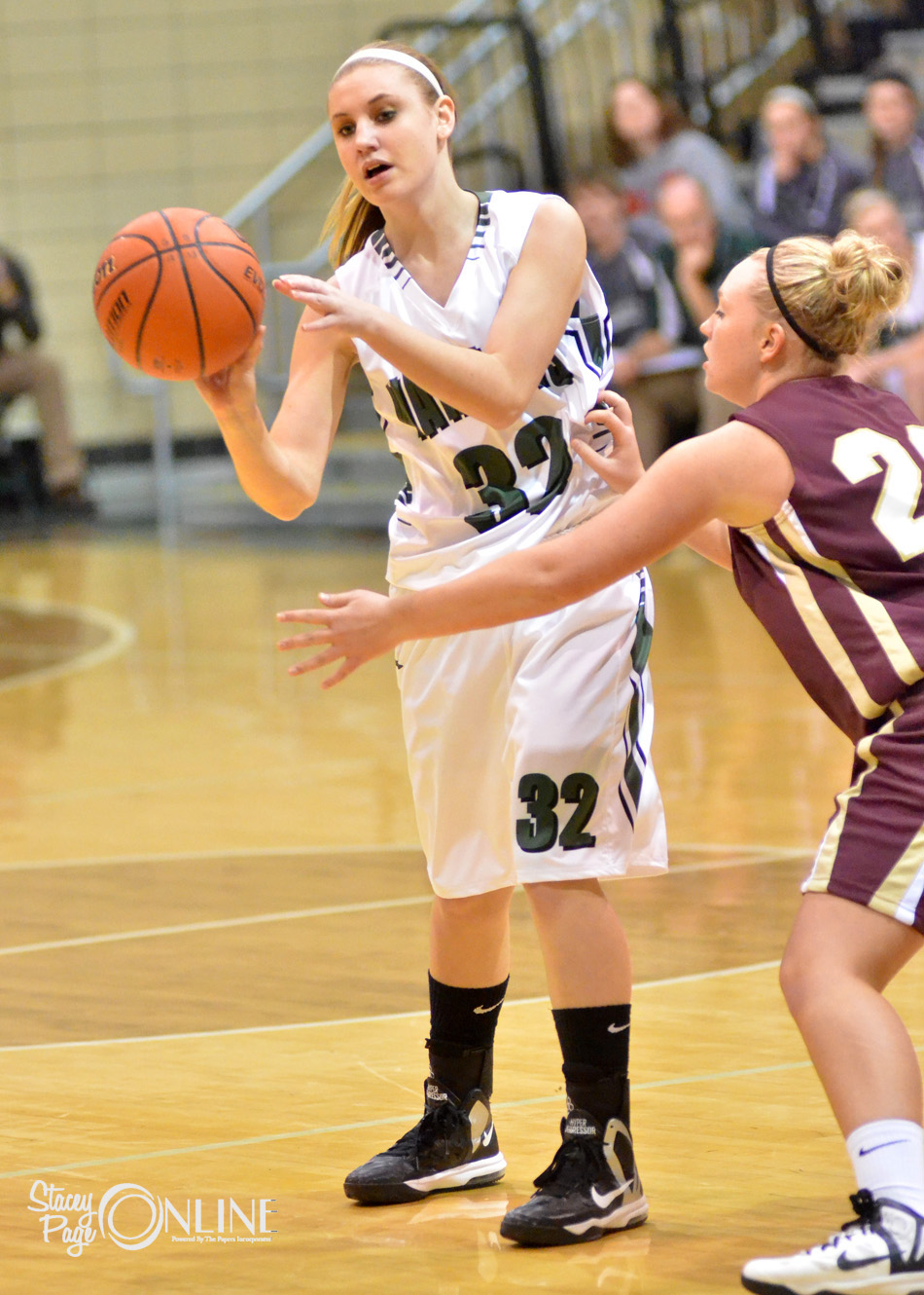 Wawasee's Ashlynn FIsher passes around City's Britney Renninger.