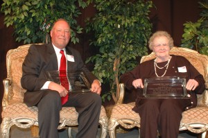 Jerry Clevenger of Winona Lake was named Man of the Year, and Mary Ettinger of Warsaw was named Woman of the Year during the Warsaw/Kosciusko County Chamber of Commerce's annual membership dinner. (Photo by Phoebe Muthart)