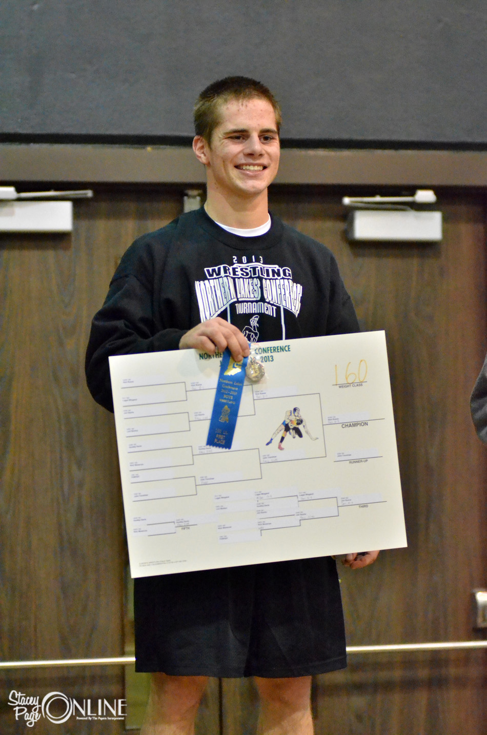 Wawasee 160-pounder Nick Rozow stands proud after winning the weight class at the Northern Lakes Conference Wrestling Championships. (Photos by Nick Goralczyk)