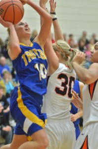 Taylor Hatfield powers her way to the basket over Tatum Schultz of Culver Friday night.