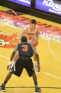 Jared Bloom looks to make his way past Freddie Rhodes Friday night. Bloom scored a game-high 24 points for Warsaw.