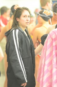 Warsaw's Cynthia Juarez looks up into the crowd after winning the sectional title Saturday in the 500 freestyle race at WCHS.