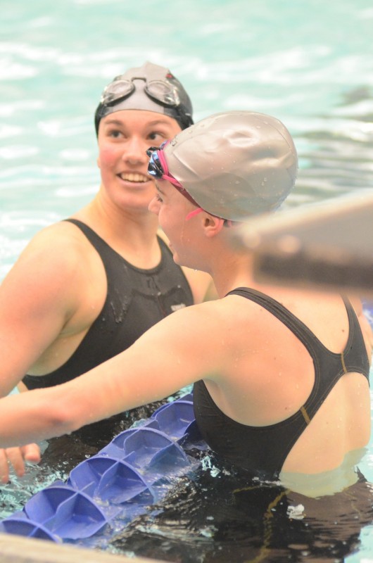 Ashley Van Wormer looks up at the scoreboard Saturday after winning a sectional championship in the .100 breaststroke event