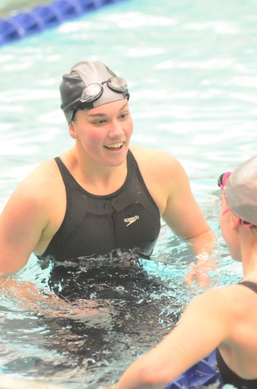 Warsaw's Ashley Van Wormer is all smiles Saturday after winning a  championship in the 100 breaststroke at the Warsaw Sectional.