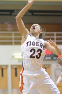 Jennifer Walker-Crawford scores two of her game-high 18 points for Warsaw Tuesday night.