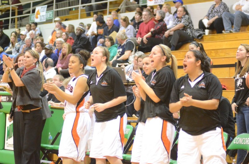 The Warsaw bench celebrates a play during second half action Tuesday night of a 49-37 sectional win over Elkhart Memorial.