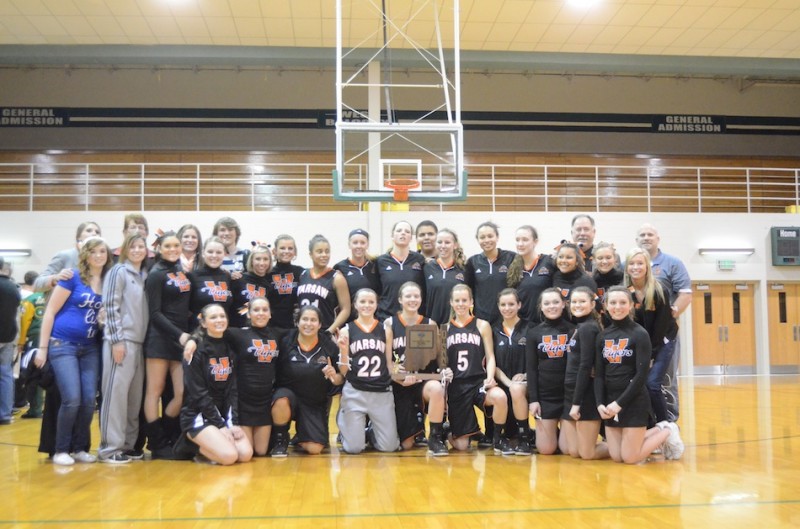 The Warsaw girls basketball team is all smiles Saturday night after winning the sectional championship at Concord. The Tigers advance to play Penn in the Valparaiso Regional next Saturday.