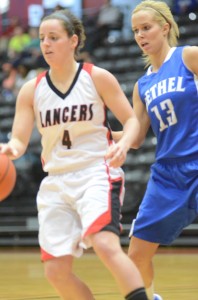 Grace freshman Heather House drives past Bethel's Laura Johnson Wednesday night. No. 13 Bethel topped the host Lancers 62-55.