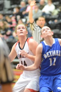 Emily Bidwell of Grace, a Whitko High School alum, battles for rebounding position with Alyshia Harvey of Bethel Wednesday night.