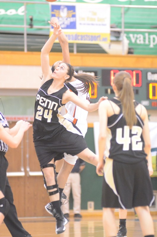 Penn's Caroline Buhr goes up against Jennifer Walker-Crawford for the opening tip-off Saturday at Valparaiso.