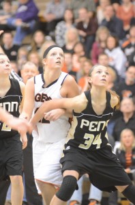 Warsaw standout Nikki Grose and Camryn Buhr of Penn look to rebound Saturday. Grose had a stellar showing with 22 points and 12 rebounds in Warsaw's win.