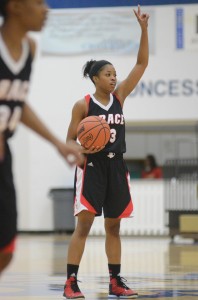 Grace guard Juaneice Jackson calls out a play at Bethel Tuesday night. Jackson led the Lancers with 16 points in a 77-59 loss to the No. 13 Pilots in the first round of the conference tournament.