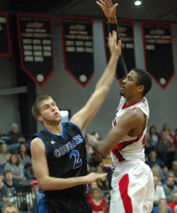 Grace's Dennis Williams shoots a hook shot Saturday during a home win over Saint Francis.