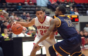 Grace guard Niko Read drives on a Marian defender Wednesday night. The host Lancers lost 62-54 in the first round of the Crossroads League Tournament (Photo provided by Grace College Sports Information Department)