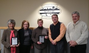 From left are Jean Ann Dennie and Stephanie Salyer who were honored Monday evening for their volunteerism with the Warsaw Community Development Corporation; Mark Dobson of the Warsaw/Kosciusko Chamber of Commerce, and Warsaw Mayor Joe Thallemer. 