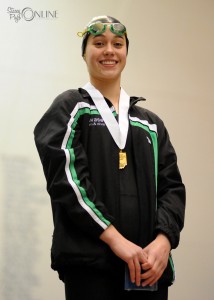 Bre Robinson stands proud after taking third place in the 100 freestyle.