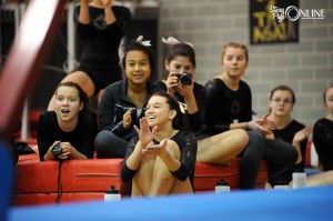 Wawasee gymnasts, from left, Paige Wright, Mia Warstler, Taylor Heck, Michaela Herendeen, Esther Hermann and Ashleigh Frecker cheer on their teammates during beam competition.