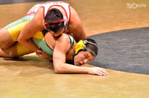 Keaton Bell of Tippecanoe Valley tries to escape the hold of South Bend Adams Eder Gallegos in the first round of the Rochester Regional.