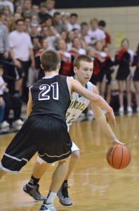 Senior guard Nick Kindig of Tippecanoe Valley works his way past Jonathan Wilkinson of NorthWood. Kindig led the Vikings to the sectional title.