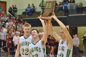 The Tippecanoe Valley trio of Tanner Andrews, Jacob Ritchey and Nick Kindig lift the sectional championship trophy high at Wawasee Saturday night (Photos by Nick Goralczyk)