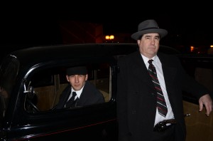 Joe Taylor was the get-away driver and Jay Jacobs portrayed John Dillinger in Friday night's re-enactment of Dillinger's 1934 heist in Warsaw. (Photo by Stacey Page)